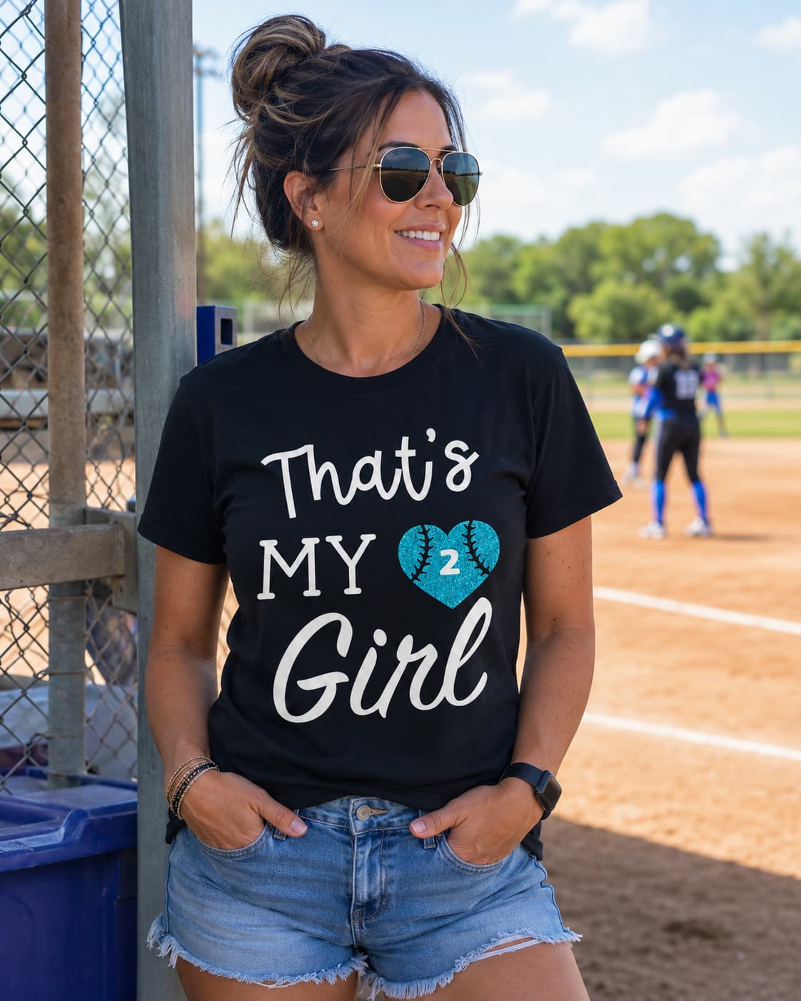 Black That's my girl shirt with a glitter number heart, worn at a ball field